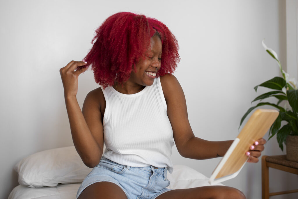 portrait braless woman home using tablet