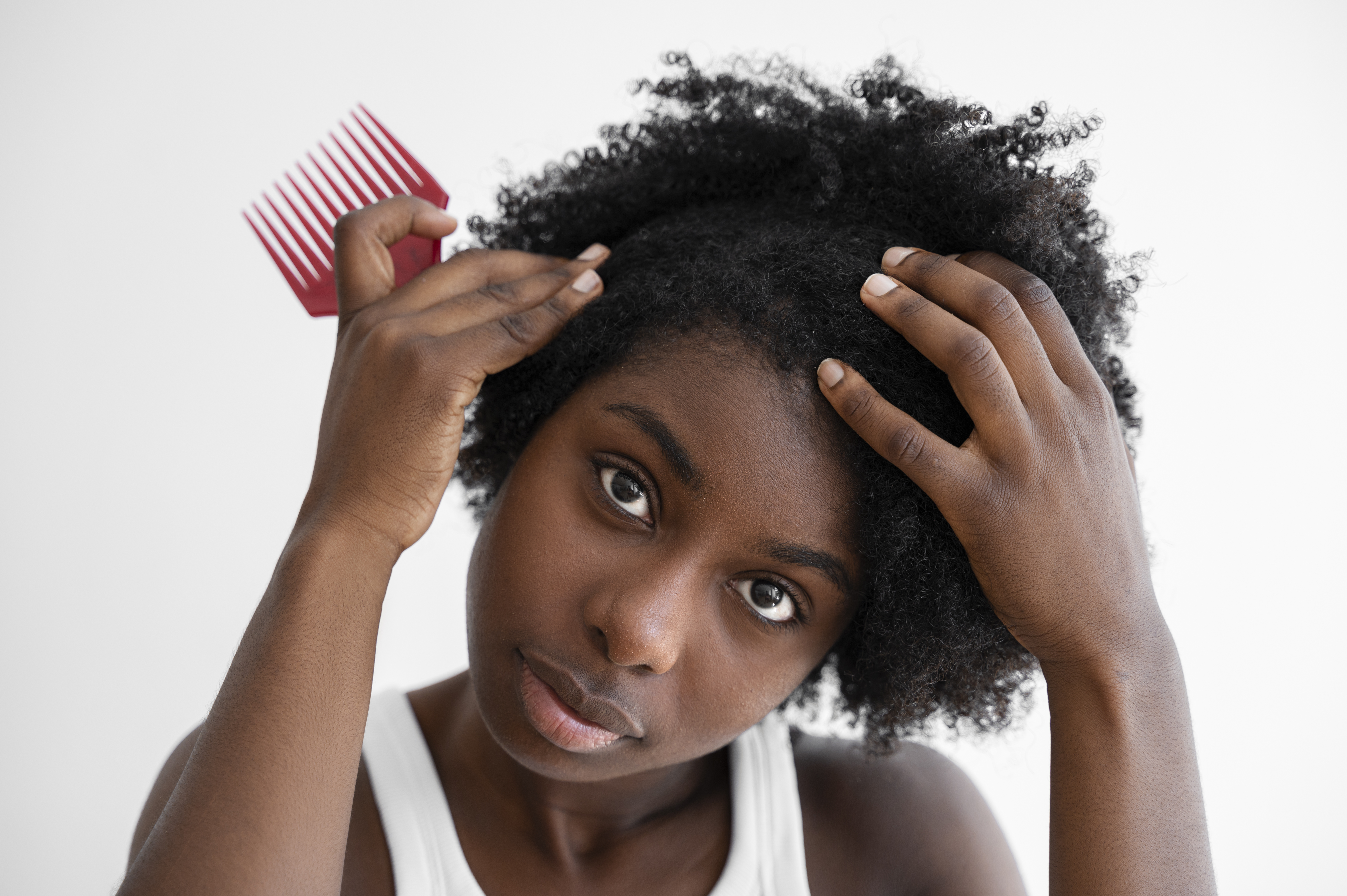 front view woman holding pink brush