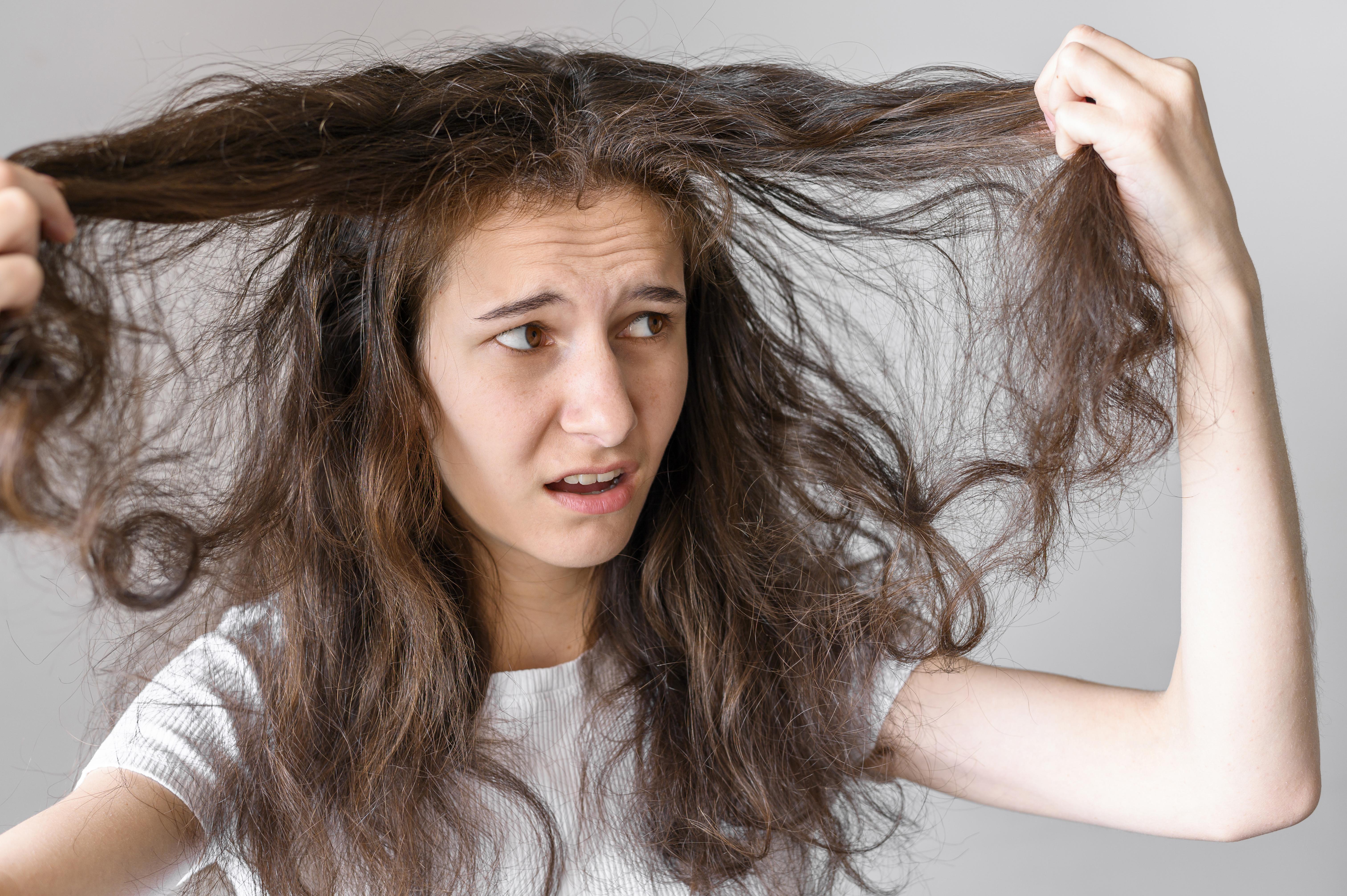 woman worried about tangled hair